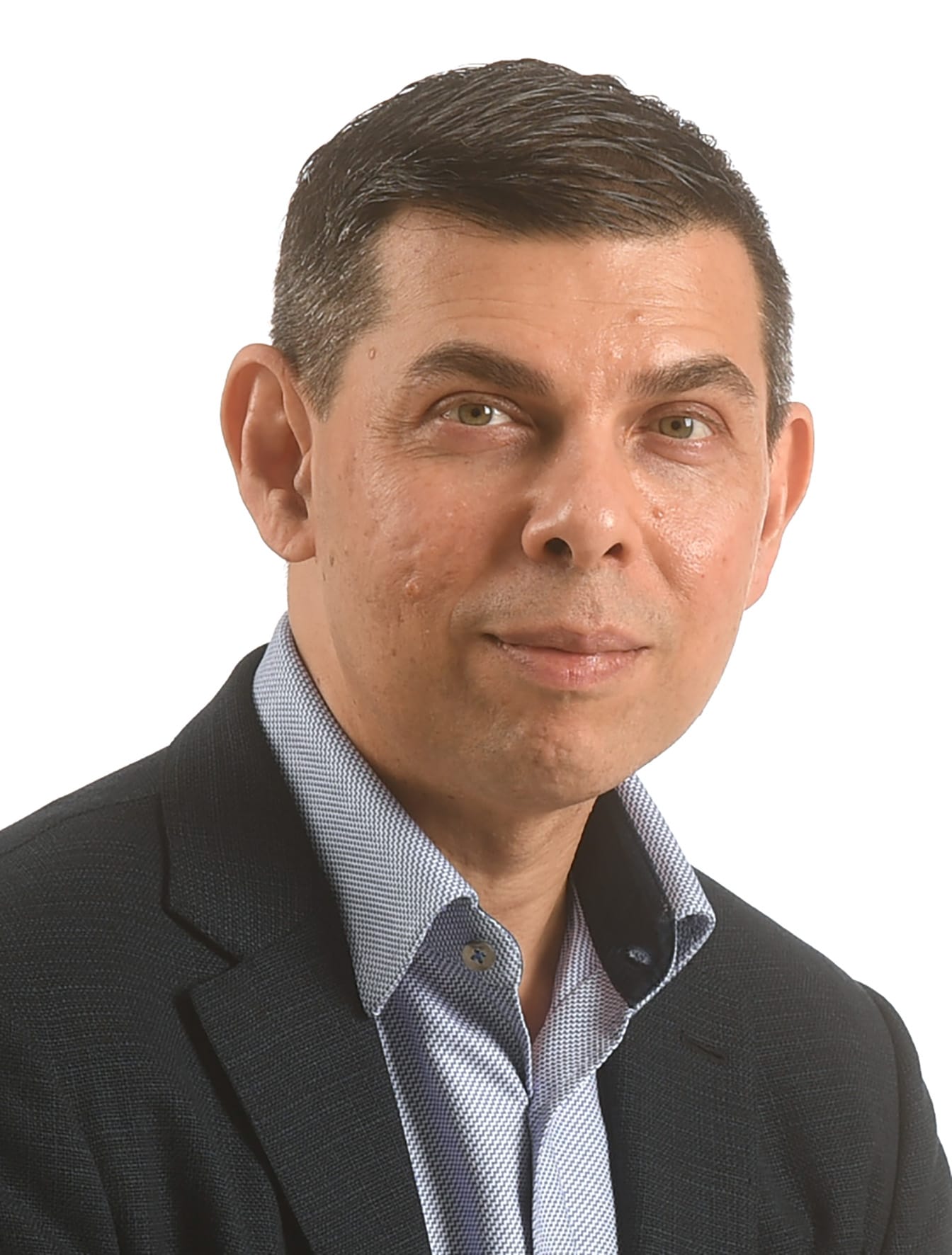 Portrait of a man wearing a patterned blue shirt and dark suit jacket.